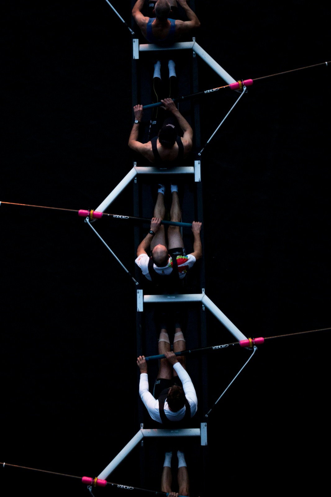 Team rowing together in synchrony